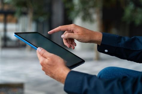 Two fingers tapping on a tablet screen to represent undo gesture
