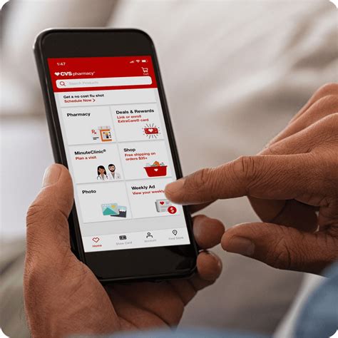 A person holding a smartphone with the CVS Photo app open, showing various photo print options.