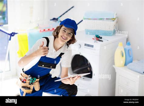 technician examining a washing machine