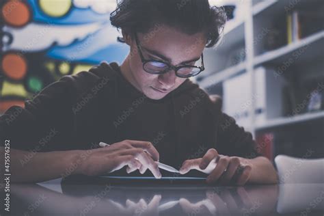 Student sketching on a digital tablet