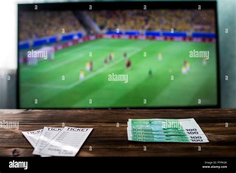 Close-up of betting tickets and money