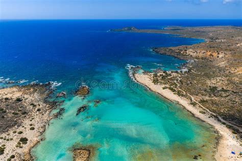 Aerial view of Livadi beach in Bali, Crete, with turquoise waters and sandy shores