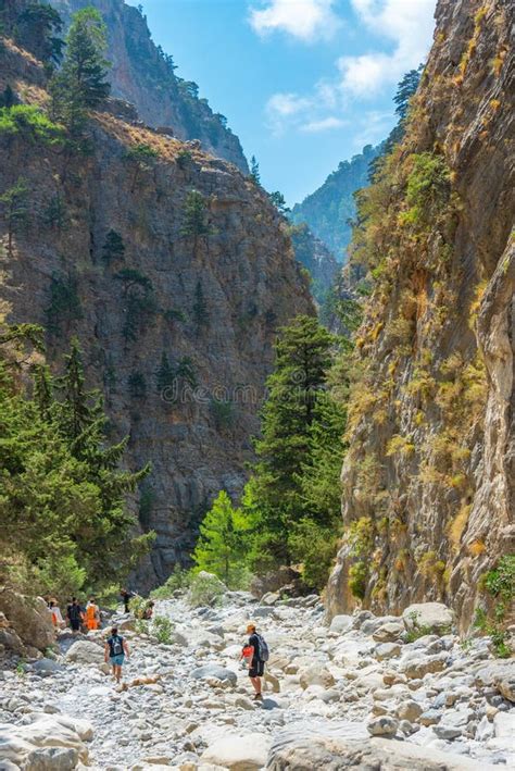 Dramatic landscape of Samaria Gorge with steep cliffs and a winding path