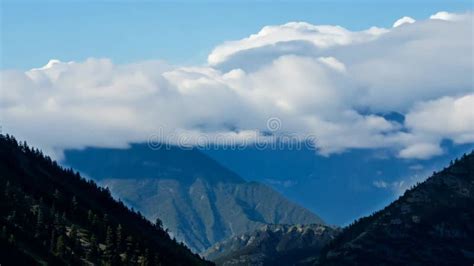 Timelapse of clouds moving across a mountain range