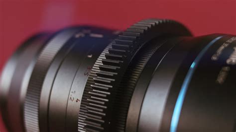 Close-up of a camera lens with focus ring taped down