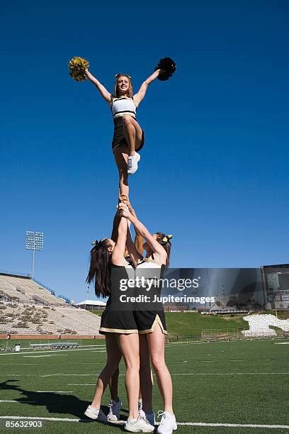 Cheerleader performing a dynamic stunt