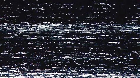 The landscape photograph with a more intense VHS effect, showcasing significant static, color distortion, and simulated dropouts