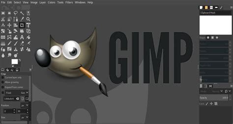 Comparison graphic showing system requirements of GIMP and Photoshop
