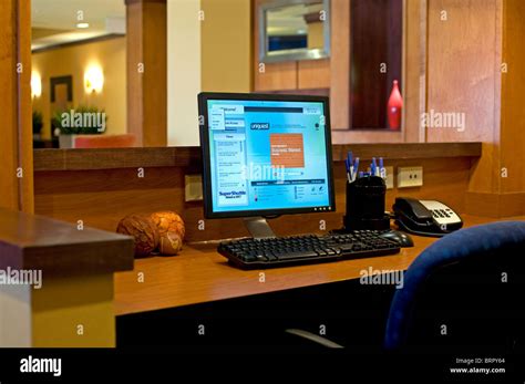 Interior of a hotel business center with computers and a printer