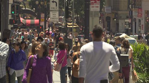 Busy street scene with a presenter