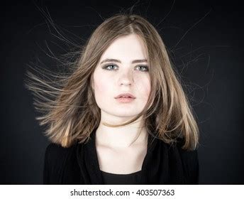 Woman with flyaway hairs in a portrait