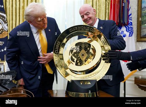 Donald Trump holding a replica FIFA Club World Cup trophy