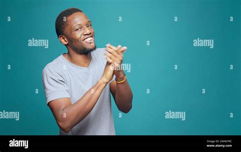 Person clapping hands in front of a camera