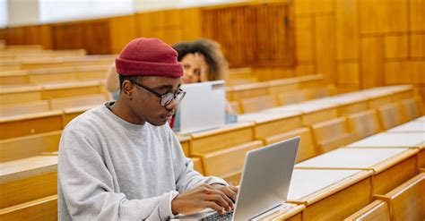 Student using a laptop to edit a video