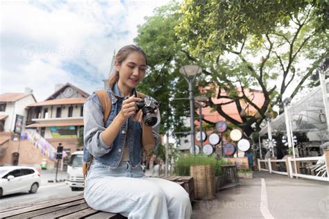 Photographer reviewing multiple shots of a model
