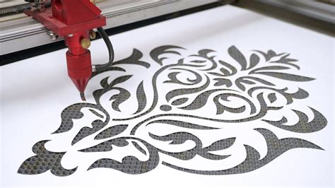 Close-up of a laser cutter working on a stencil
