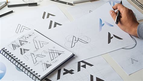 Hand-drawn logo sketches on paper