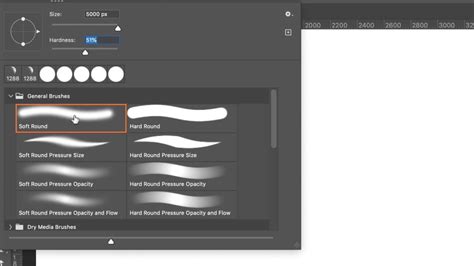 Close-up of a Photoshop brush tool being used to paint skin tone over hair