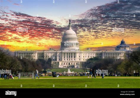 Composite image showing a building with a dramatically replaced sunset sky