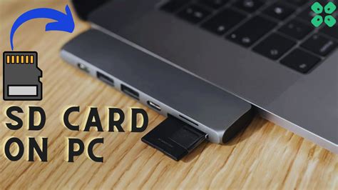 Photographer importing photos from an SD card to a computer