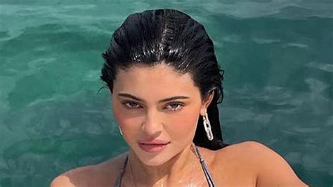 Kylie Jenner in a bikini by a pool