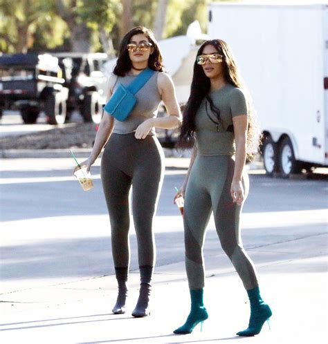 Kim Kardashian and Kylie Jenner in colorful swimsuits