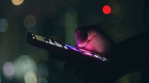 Smartphone holding a slide in front of a light source