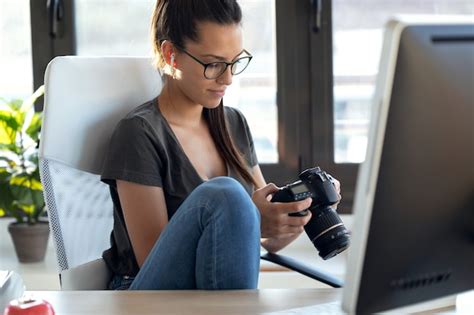 Photographer reviewing client contracts on a laptop
