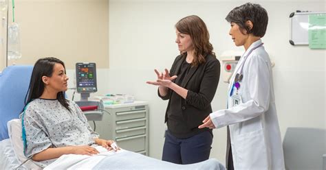 Doctor Christian Perez speaking with a patient