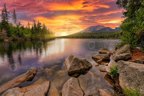 A high-contrast landscape scene at sunset
