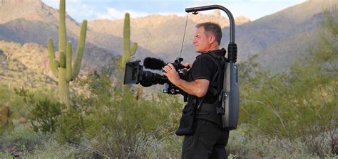 Photographer holding a camera steady