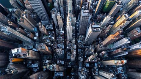 A cityscape viewed from above, with a narrow strip of sharpness and the rest blurred, giving it a miniature look.