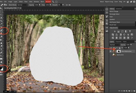 Screenshot showing a brush painting black on a layer mask to hide parts of an image